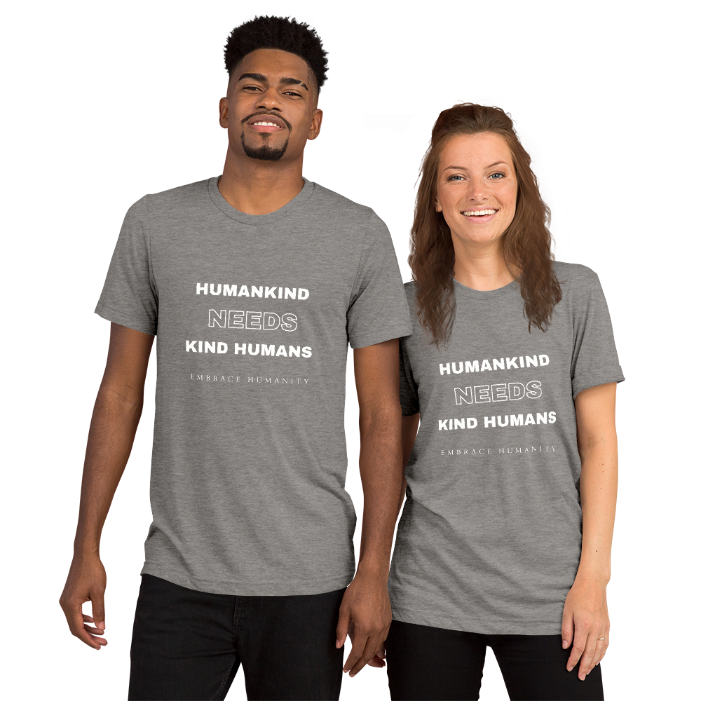 Picture of a man and a woman wearing the same t-shirt that reads, "Humankind Needs Kind Humans".